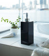 Black Yamazaki Home square shampoo dispenser by bathtub