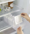 Yamazaki Refridgerator Organizer Bins being pulled out of shelf in refridgerator full of food
