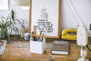 Front view of white Pen Organizer holding pens and pencils by Yamazaki Home.