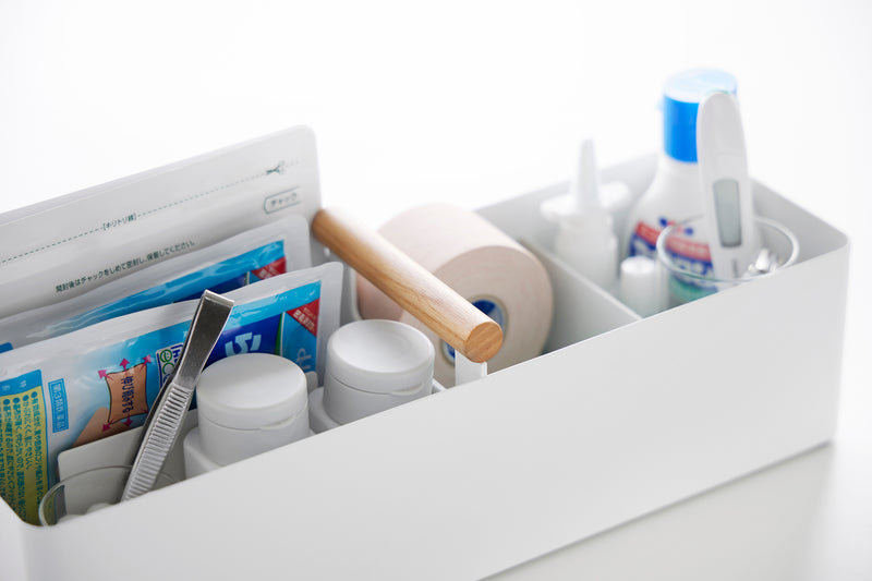 Close up of Yamazaki Home Slim Storage Box holding medical supplies