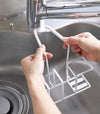 Installing a black Steel Yamazaki Home Faucet-Hanging Sponge & Brush Holder to a faucet