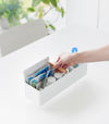 Someone holding Yamazaki Home Slim Storage Box with medical supplies
