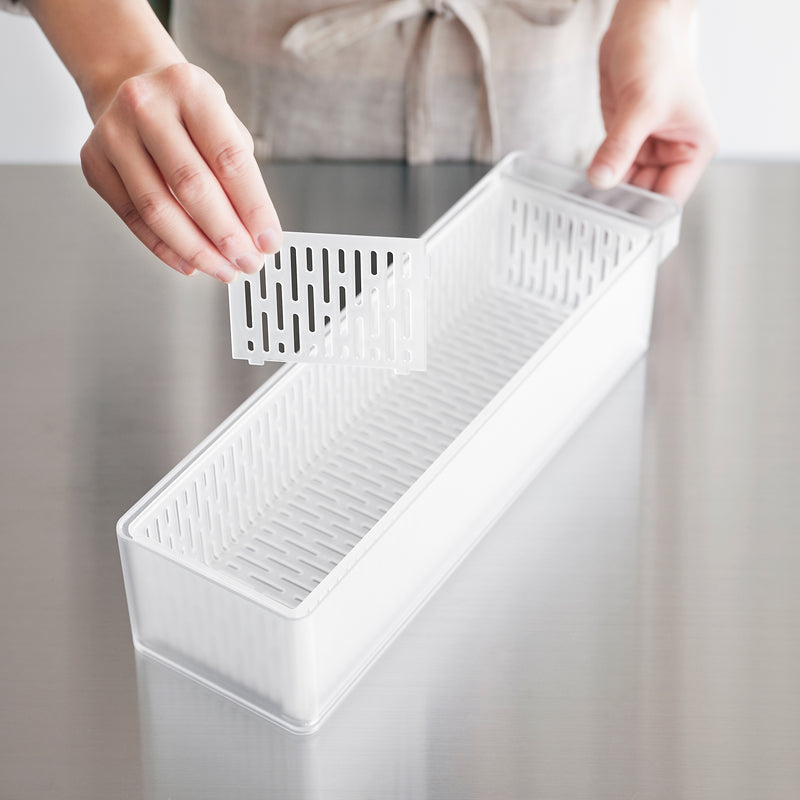 Close up of divider portion of Yamazaki Home Refrigerator Colander with Lid & Divider