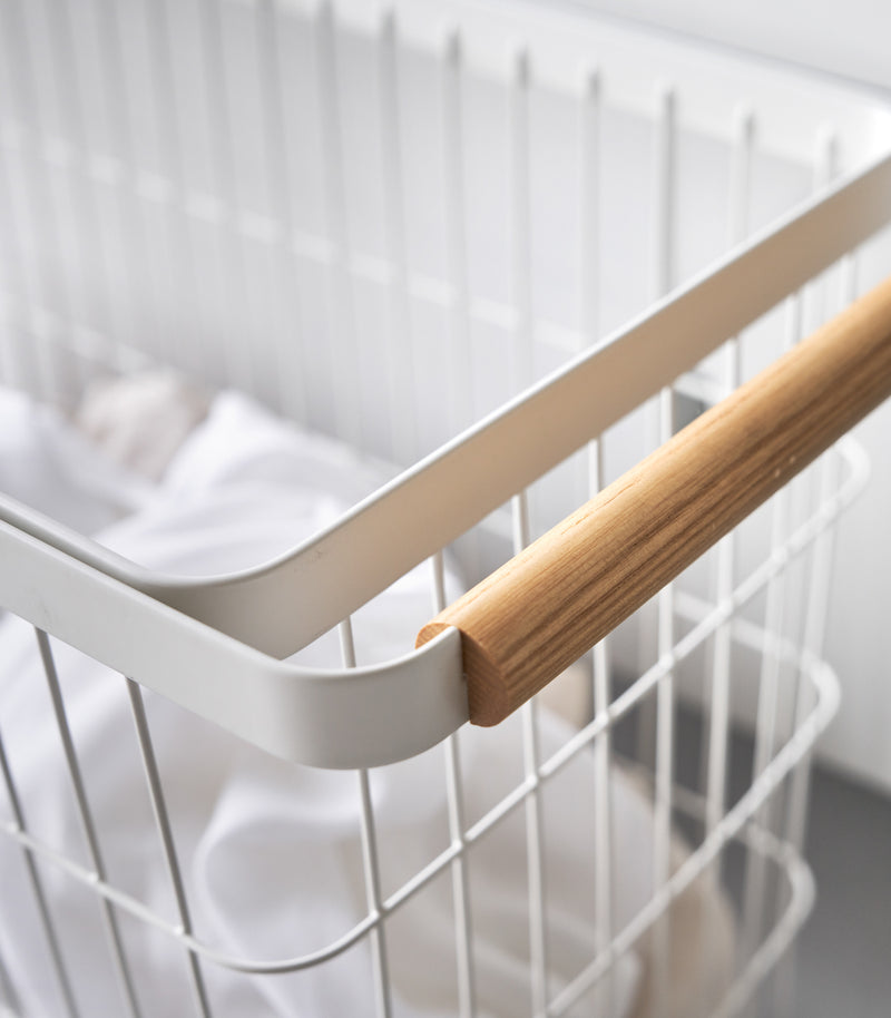 A close up of Yamazaki Rolling Wire Basket's handle.