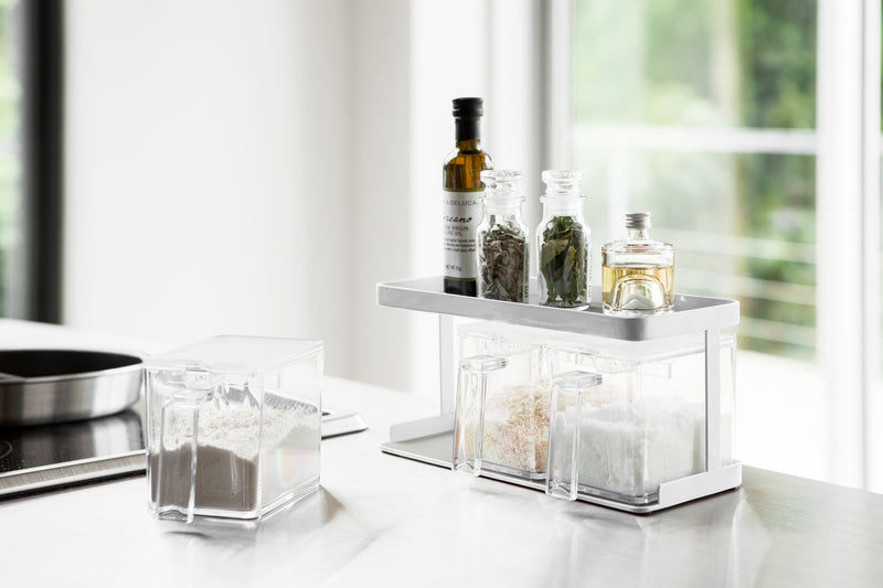 White Pantry Organizer with upper shelf holding spices and ingredients by Yamazaki Home.