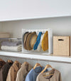 White Yamazaki Home hat rack hanging a variety of hats