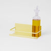 Glass bottle with a yellow shelf on a white background