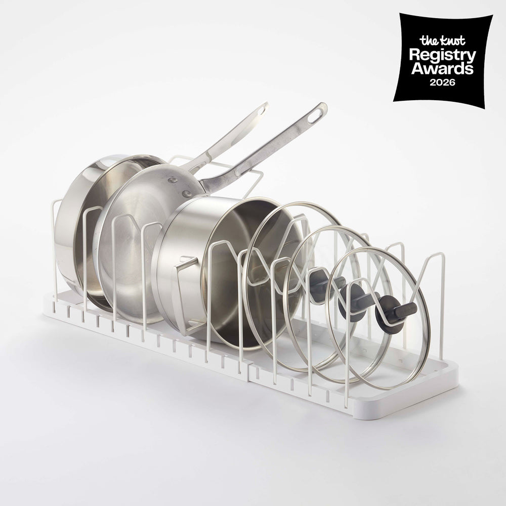 Adjustable Pot Lid Organizer in White with props on the white background, having the knot awards logo on the upper right.