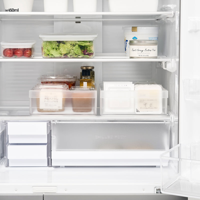Front view of two Yamazaki Home Refrigerator Organizer Bin - Wide storing food