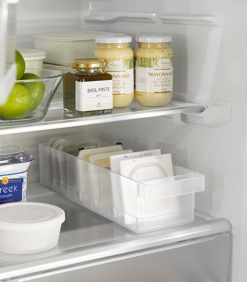 Yamazaki Refridgerator Organizer Bins on shelf in refridgerator full of food