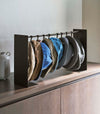 Shortened black Yamazaki Home hat rack hanging a variety of hats