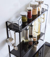Aerial view of Yamazaki Home Two-Tier Countertop Rack holding spices and oils.