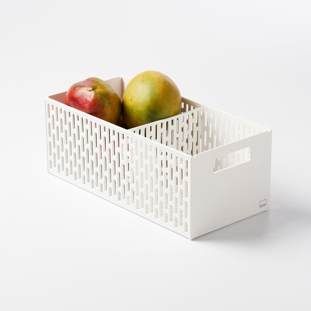 Stackable Vegetable Stocker in White holding several mangos against a white background by Yamazaki Home