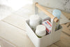 Aerial view of white Storage Caddy holding first-aid items by Yamazaki Home.