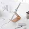 Ash Yamazaki Home Hair Dryer and Iron Stand placed on a bathroom counter with a hair iron