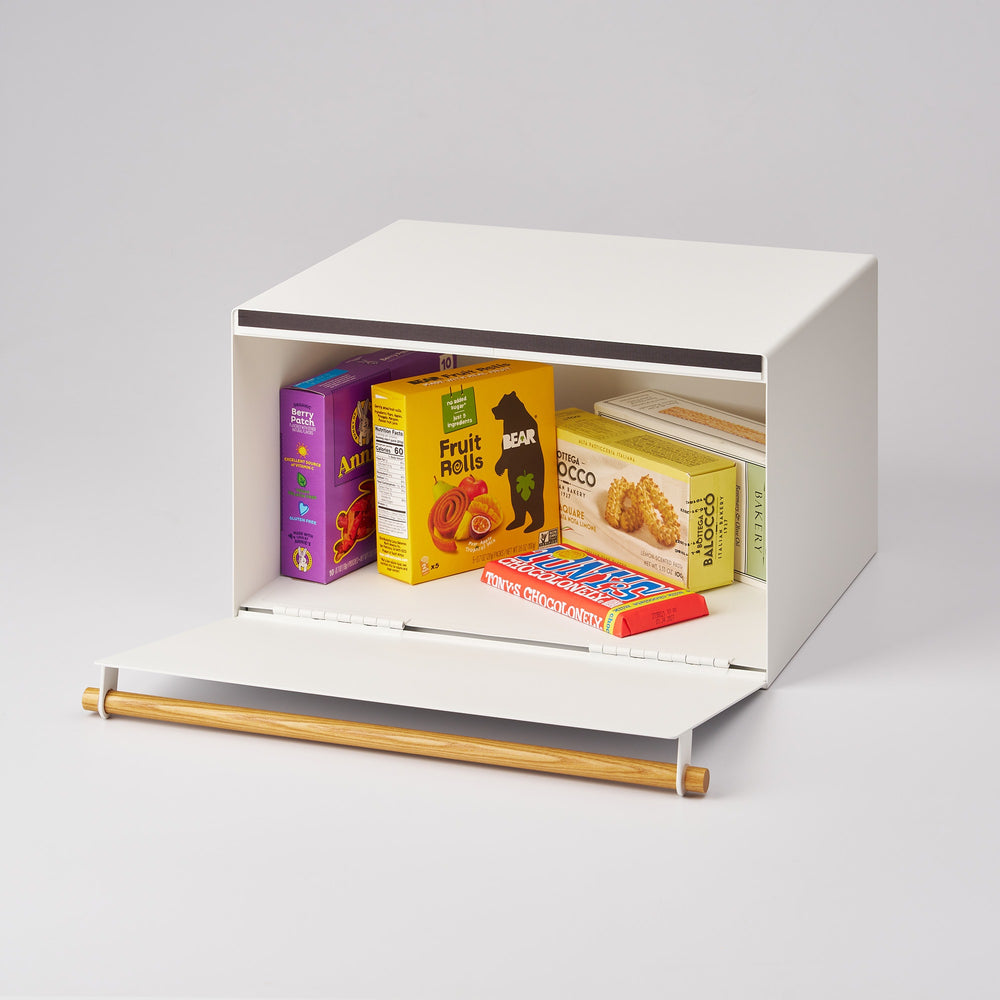 Small white breadbox with colorful boxes on a light gray background