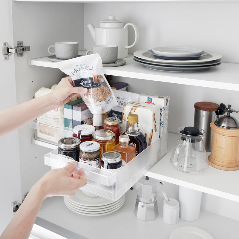 Food being pulled out of a Yamazaki Home Refrigerator Organizer Bin - Wide