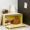 Yellow Pear Yamazaki Home Bread Box open with bread and jam inside on a kitchen counter