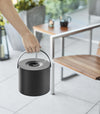 Black Yamazaki Mosquito Repellant Coil Holder and Storage Case being held outside