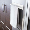 Side view of white Magnetic Paper Towel Holder holding towel by Yamazaki Home.