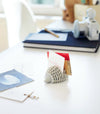 Gray Hedgehog Business Card Hold holding cards on office desk by Yamazaki Home.