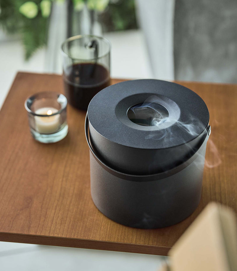 Black Yamazaki Mosquito Repellant Coil Holder and Storage Case on a table