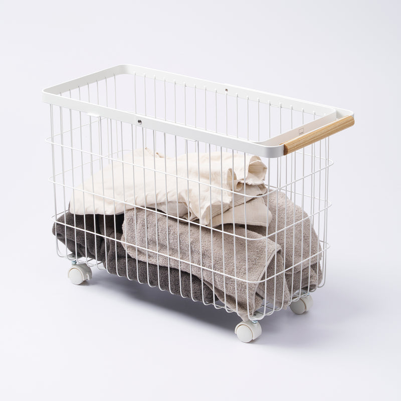 Yamazaki Home Rolling Wire Basket with props, set against a white background.