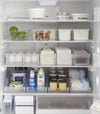 Full frontal view of Yamazaki Refridgerator Organizer Bins full of food inside a refridgerator