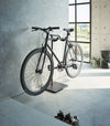 Yamazaki Home Bicycle Stand in an entryway storing a bicycle