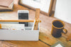 Aerial view of white Desk Organizer holding ruler, pens and phone on counter by Yamazaki Home.