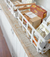 Close up aerial view of white Storage Basket holding food items by Yamazaki Home.