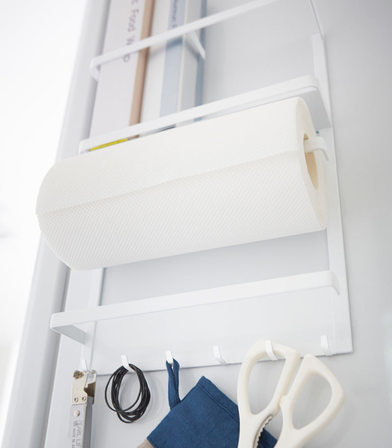 White Magnetic Organizer holding kitchen items by Yamazaki Home.