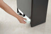 Close up bottom view of black Rolling Diaper Stacker holding diapers by Yamazaki Home.