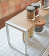 White Stackable Shoe Rack in bedroom by Yamazaki Home.