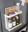 White Magnetic Wrap Holder holding books and spices by Yamazaki home.