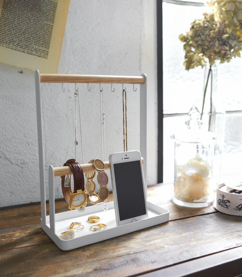Aerial view of white Undershelf Organizer holding spices in kitchen by Yamazaki Home.