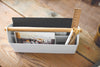 Top Aerial view of white Desk Organizer holding paper, ruler, and pens by Yamazaki Home.