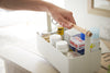 White Storage Caddy holding first aid items by Yamazaki Home.