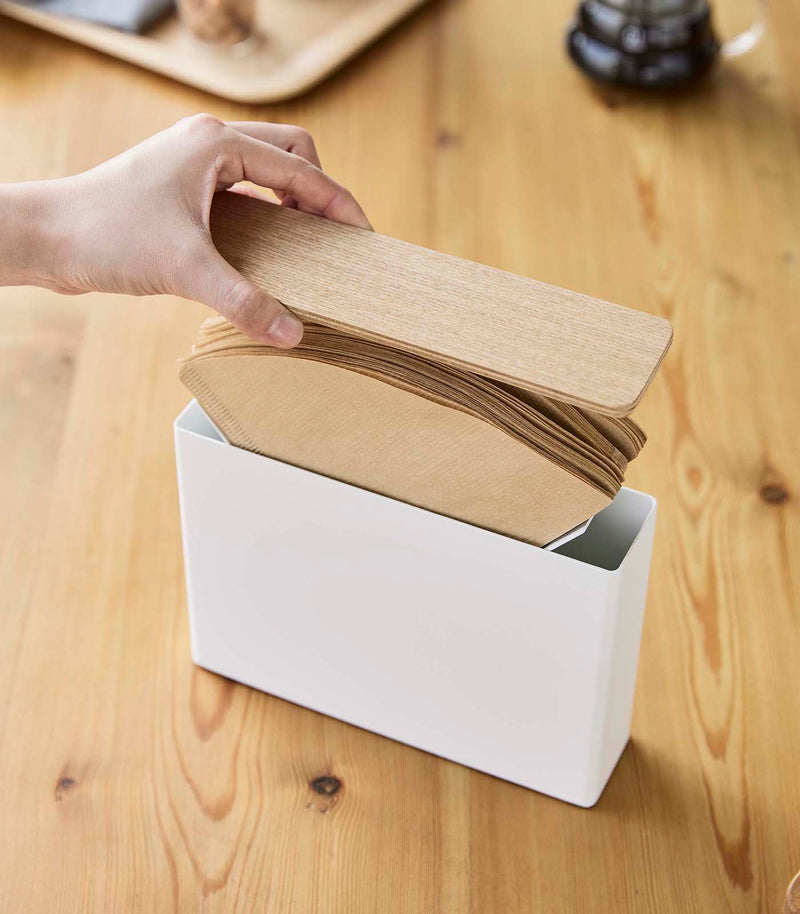 Person lifting up Coffee Filter Case cover by Yamazaki Home.
