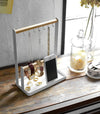White Undershelf Stemware Holder holding wine glasses by Yamazaki Home.