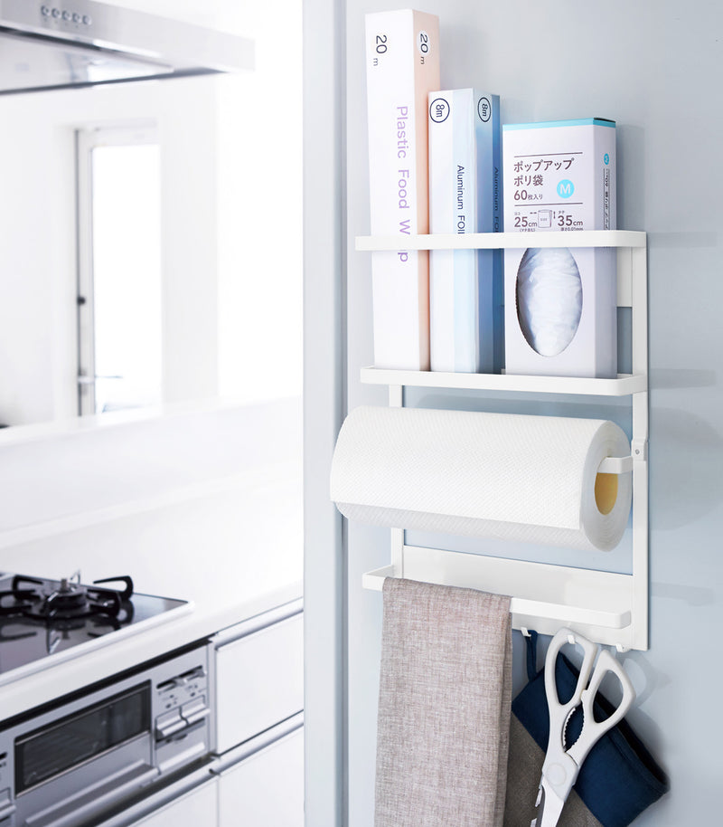 Front view of white Magnetic Organizer holding kitchen equipment by Yamazaki home.