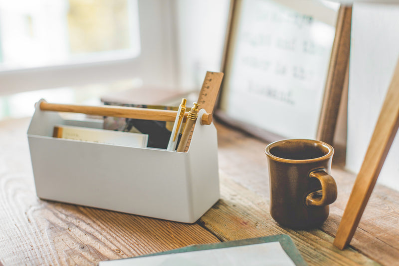 White Desk Organizer holding ruler, pens and paper by Yamazaki Home.
