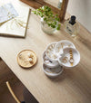 Aerial view of Stacked Jewelry Box holding jewelry and accessories on vanity by Yamazaki Home.