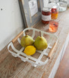 Aerial view of white Food Bowl holding lemon and pears by Yamazaki Home.