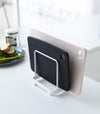 White Cutting Board Stand holding cutting boards by Yamazaki Home.