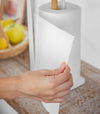 Close up view of Paper Towel Holder on kitchen shelf by Yamazaki Home.