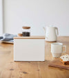 Front view of Coffee Filter Case on table by Yamazaki Home.