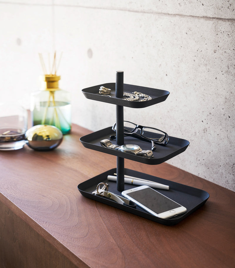Black Magnetic Placemat Organizer on kitchen fridge holding mats by Yamazaki home.