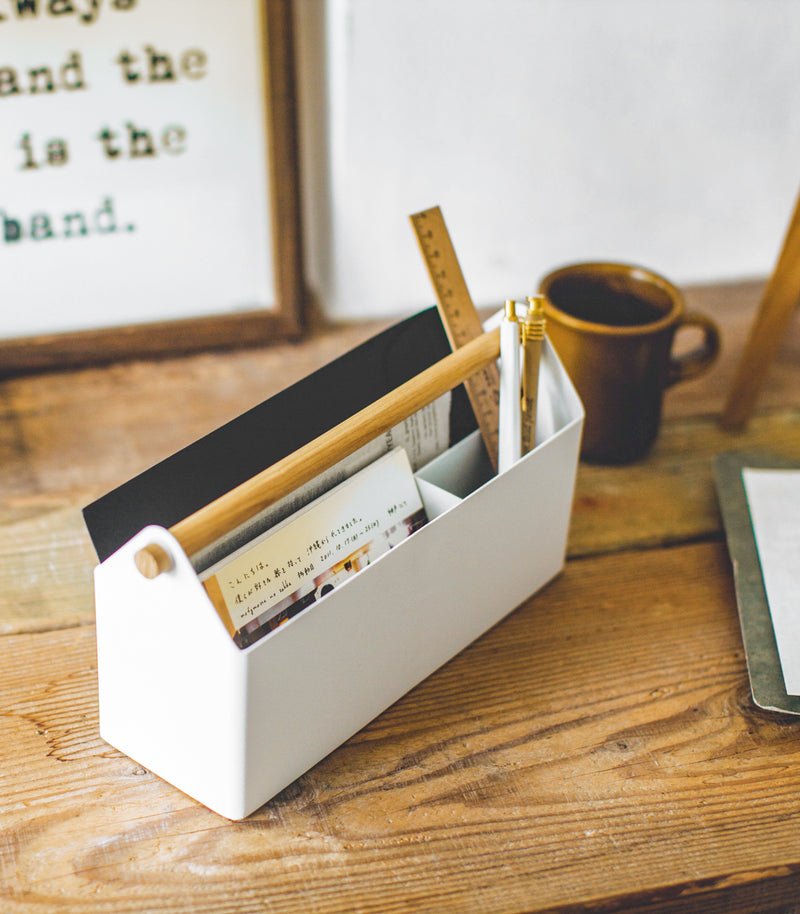 Aerial side view of white Desk Organizer holding writing items by Yamazaki Home.