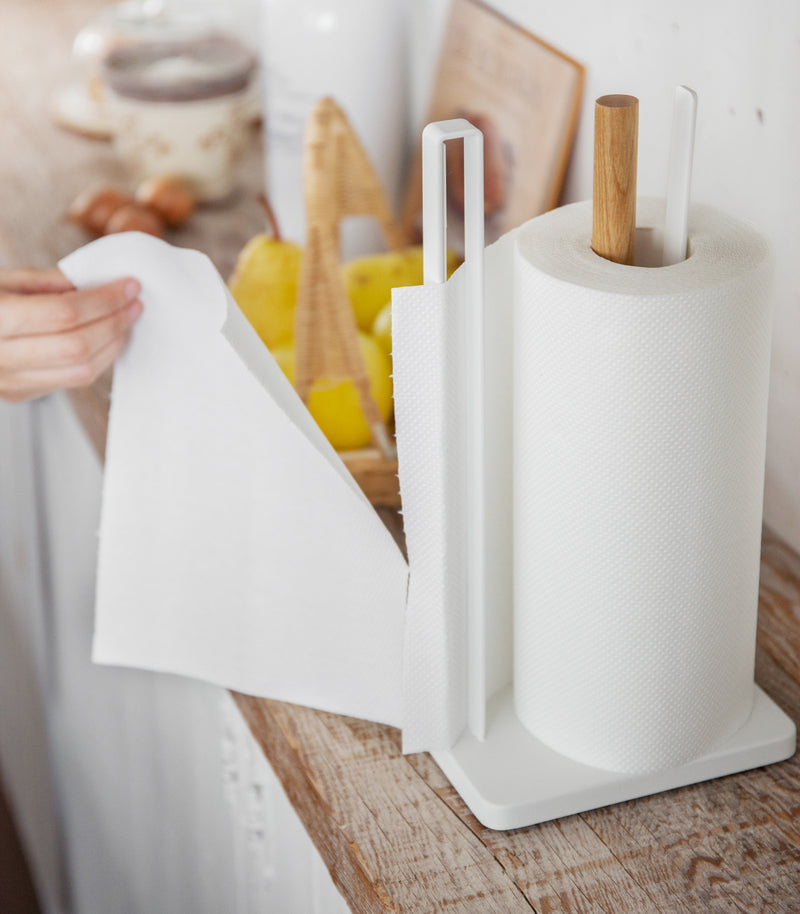 Side view of Paper Towel Holder on kitchen shelf by Yamazaki Home.